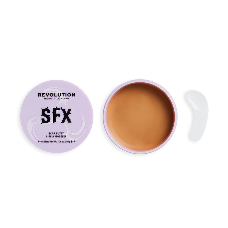 Open pot of SFX Scar Putty with skin coloured wax and the lid next to it